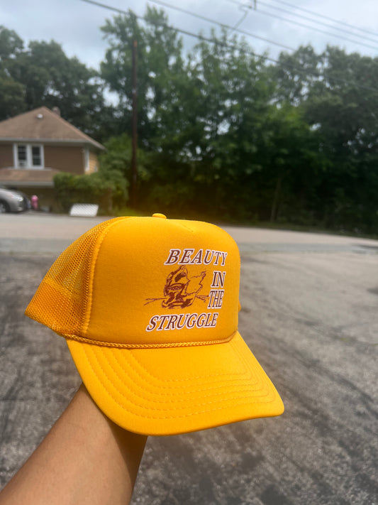 Beauty Of The Struggle Trucker Hat Gold